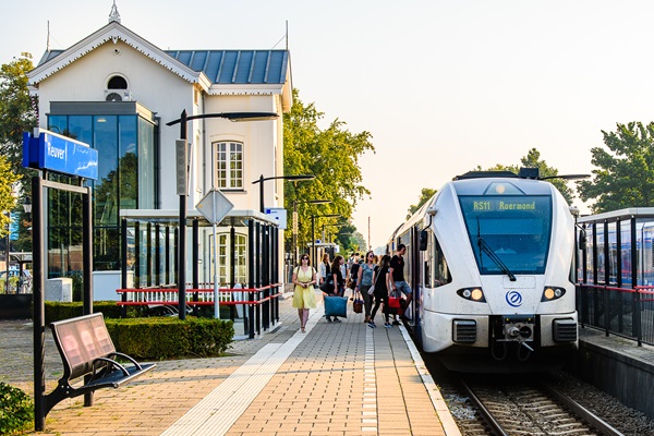 People board the Arriva train to Roermond at Reuver station