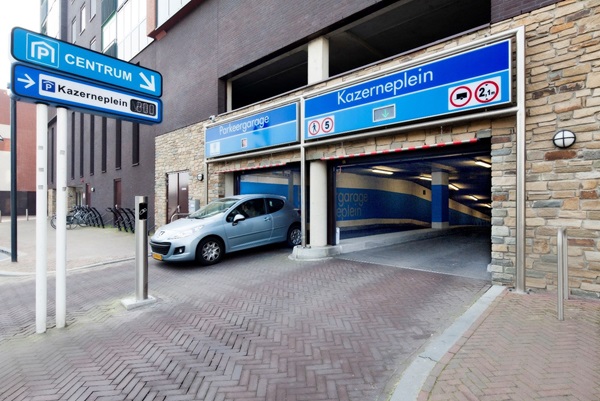 Entrance to the Kazerneplein car park in Roermond where a car is just leaving